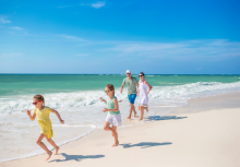 Family running on Pensacola Beach