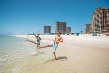 Kids playing in the water on Pensacola Beach