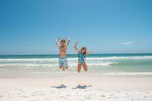 Kids jumping in excitment for Spring Break on Pensacola Beach