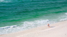 Couple walking on Pensacola Beach, FL