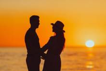 Couple enjoying the sunset on Pensacola Beach