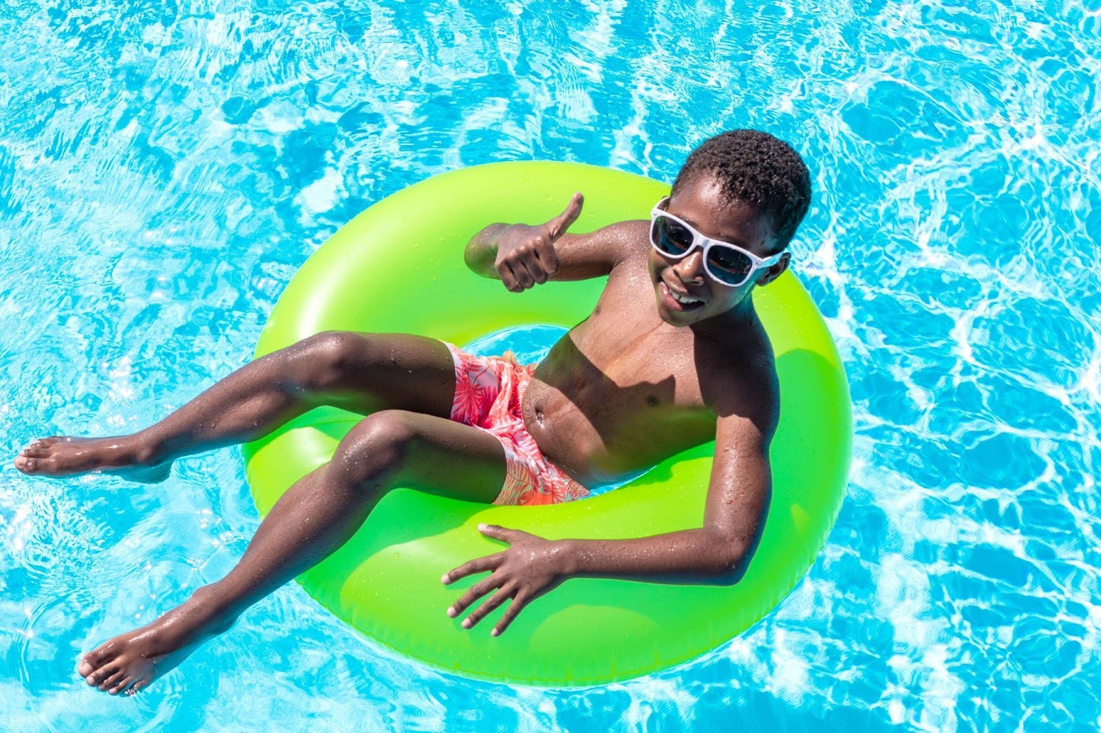 boy playing in resort pool